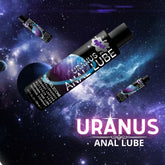 A bottle of "Wet Uranus Anal Lubricant 🍑" from Wet is floating in a space-themed background adorned with planets and stars. The label highlights its qualities: pure silicone, long-lasting, hypoallergenic, and non-sticky. The main bottle stands out prominently with smaller bottles in the backdrop.
